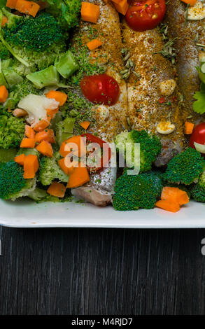 fresh dish filled with vegetables-carrot, broccoli, thyme, garlic Stock Photo
