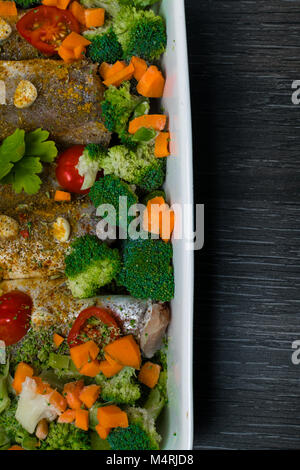 fresh dish filled with vegetables-carrot, broccoli, thyme, garlic Stock Photo