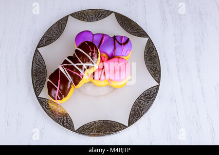 Variety type of delicious donuts Colorful donuts on stone table. Top view Stock Photo