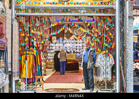 Tehran, Iran - April 29, 2017: Iranian man sells souvenirs in the market. Stock Photo