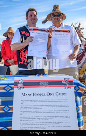 Chief Justin George of Tsleil-Waututh Nation and Chief Gibby Jacob of Squamish Nation sign a historic declaration to protect the Salish Sea.Many Peopl Stock Photo