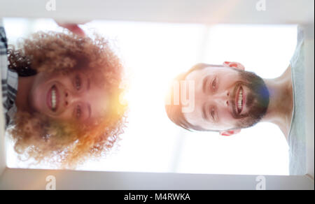 View from the bottom of the newlyweds looking inside the box. Stock Photo