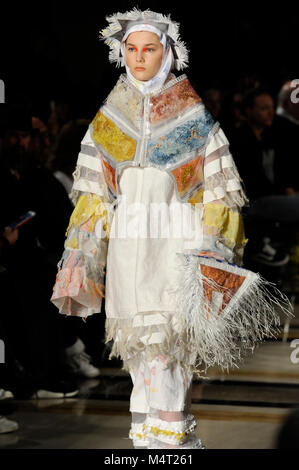 Model on the catwalk during the Maddie Williams fashion show at Fashion Scout AW18 at Freemasons Hall, Covent Garden, London, UK. Fashion Scout takes place during London Fashion Week. Maddie Williams graduated from University of Edinburgh last year, winning Fashion Scout Graduate Week's Catwalk Textiles Award and the Dame Vivienne Westwood Ethical Award. 17th February 2018. Credit: Antony Nettle/Alamy Live News Stock Photo