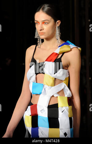 Model on the catwalk at the Susan Fang fashion show at Fashion Scout AW18 at Freemasons Hall, Covent Garden, London, UK. Fashion Scout takes place during London Fashion Week. Susan graduated from Central St. Martins in 2015. 17th February 2018. Credit: Antony Nettle/Alamy Live News Stock Photo