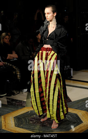 Model on the catwalk at the Susan Fang fashion show at Fashion Scout AW18 at Freemasons Hall, Covent Garden, London, UK. Fashion Scout takes place during London Fashion Week. Susan graduated from Central St. Martins in 2015. 17th February 2018. Credit: Antony Nettle/Alamy Live News Stock Photo