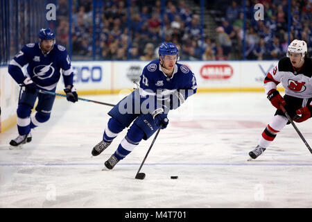 Tampa, Florida, USA. 17th Feb, 2018. DOUGLAS R. CLIFFORD | Times .Tampa Bay Lightning center Brayden Point (21) races past New Jersey Devils center Nico Hischier (13) into the New Jersey zone during the first period of Saturday's (2/17/18) game between the Tampa Bay Lightning and the New Jersey Devils at Amalie Arena in Tampa. NOTE: former Lightning player Brian Boyle is a fan favorite and player for NJ. SHOOT: Backup goalie Louis Domingue, Yanni Gourde Credit: Douglas R. Clifford/Tampa Bay Times/ZUMA Wire/Alamy Live News Stock Photo