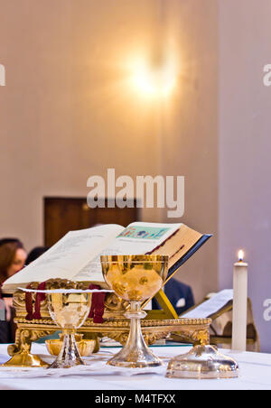 on the altar of the pyx and chalice mass they contain wine and hosts, blood and body of Christ Stock Photo