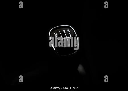 Manual transmission gear shift, on dark backgroun. Stock Photo
