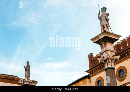 RAVENNA, ITALY - FEBRUARY 15, 2018: the statues of Saint Vitale and Saint Apollinaris  rise in Piazza del Popolo Stock Photo