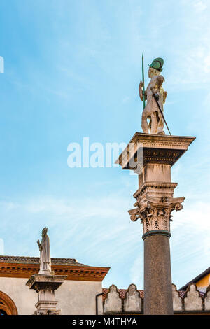 RAVENNA, ITALY - FEBRUARY 15, 2018: the statues of Saint Vitale and Saint Apollinaris  rise in Piazza del Popolo Stock Photo