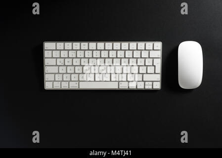 Wireless Keyboard and mouse on a black background. Stock Photo