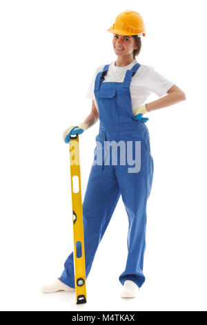 Young beautiful handywoman with building level isolated on white Stock Photo