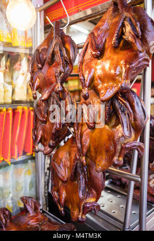 Roasted Ducks Hanging On Food Stall At Street Market Stock Photo