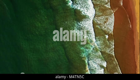 Aerial View From Flying Drone Of Ocean Waves Crushing On Beach Stock Photo