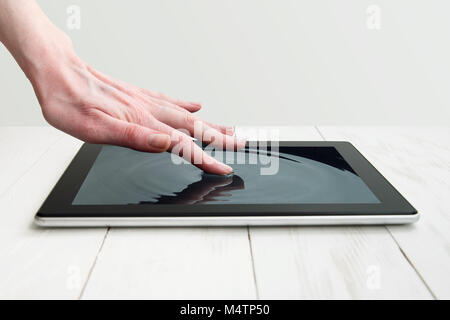 human hand touching futuristic screen. Stock Photo