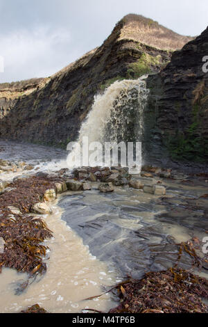 Waterfall at Kimmeridge Bay Dorset, UK after heavy rain Stock Photo