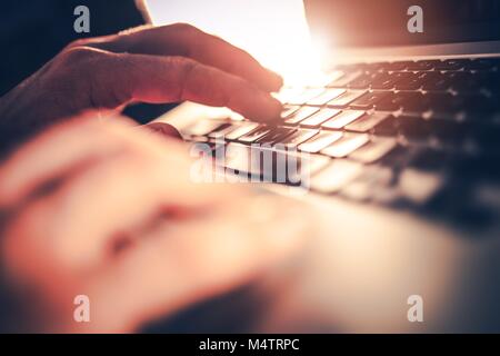 Computer Office Work. Caucasian Hands on the Laptop Keyboard. Internet and Networking Concept. Stock Photo