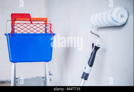 Room Painting Equipment. Paint Bucket, Ladder and Roller. Stock Photo