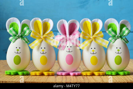 Colored easter eggs bunny, wooden background. Happy Easter Stock Photo