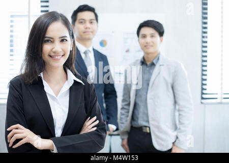 Asian business women and group using notebook for meeting and business women smiling happy for working Stock Photo