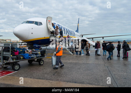 Passengers boarding a Ryanair jet after their new cabin bag policy came into effect - many passenger bags must now be stowed in the aircraft hold Stock Photo