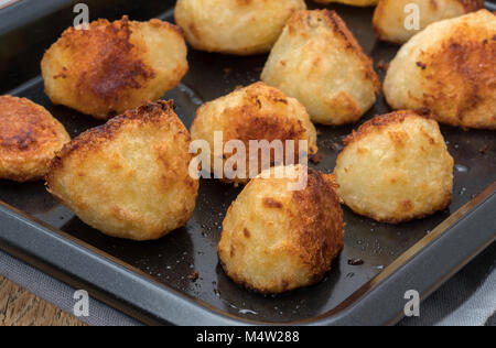 Close-up of fresh roast potatoes Stock Photo
