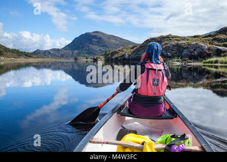 Canoeing on Upper Lough, Killarney Lakes, Killarney National Park, County Kerry, Ireland. Stock Photo