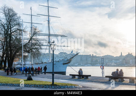 People enjoy a Sunday walk during autumn at Skeppsholmen island in Stockholm. The capital city of Sweden is built on 17 islands. Stock Photo