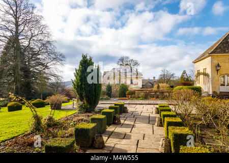 Painswick House with flagstone paved patio terrace and box hedges Painswick Rococo Garden, Painswick, Gloucestershire Cotswolds, Stock Photo