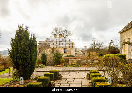 Cotswold stone Painswick House with flagstone paved patio terrace and box hedges Painswick Rococo Garden, Painswick, Gloucestershire Cotswolds Stock Photo