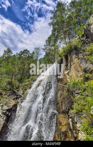Summer mountain landscape of Kamyshlinsky waterfall in rocks of Altai Stock Photo