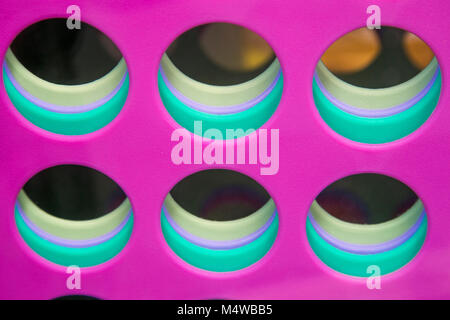 Plastic abstract with circular holes and coloured layers Stock Photo