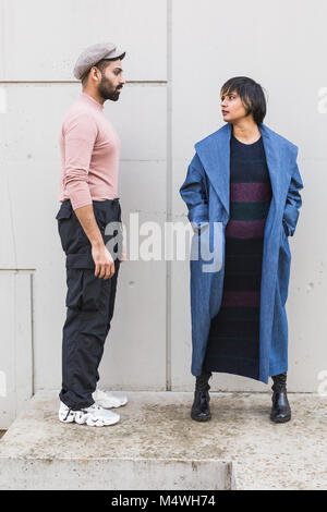 Beautiful Indian couple posing in an urban context. Street fashion and style. Stock Photo