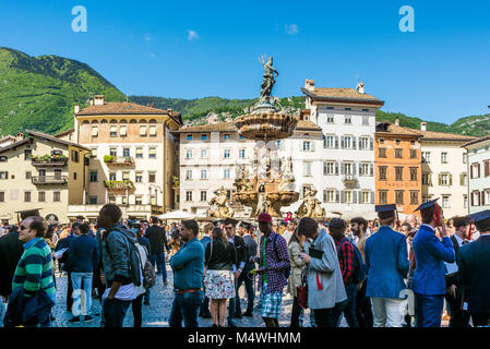 the graduation ceremony in the main square of the city of Trento. The city is famous for the prestigious universities. Stock Photo