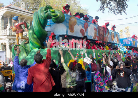 Mardi Gras float in the Zulu parade with costumed parade-goers. Stock Photo