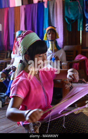 Ywama: Kayan Lahwi (Padaung) Long Neck girl woman weaving, weaver loom, Inle Lake, Shan State, Myanmar (Burma)