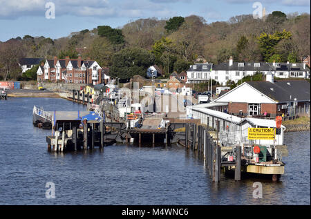 Lymington pier in Hampshire on the edge of the new forest and the Isle of Wight ferry terminal for the car ferries to Yarmouth. Transport by sea rail Stock Photo