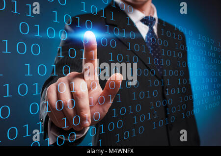 Virtual multimedia display. A man in a suit and tie clicks his index finger on the virtual screen Stock Photo