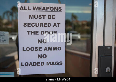 Palm Beach Gardens, Florida, USA. 18th Feb, 2018. Pictured is a sign seen at the entrance to the Brooklyn Firearms show at the Amara Shrine Temple in Palm Beach Gardens, Fla., on Sunday, February 18, 2018. Credit: Andres Leiva/The Palm Beach Post/ZUMA Wire/Alamy Live News Stock Photo
