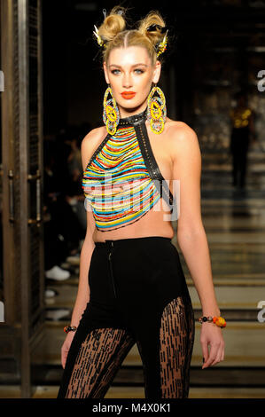 Model on the catwalk during the Limkokwing University fashion show at Fashion Scout AW18 at Freemasons Hall, Covent Garden, London, UK. Fashion Scout takes place during London Fashion Week. With a base in Chancery Lane, London, Limkokwing is a private Malaysian university which operates in 14 countries across the world and tecahes students in creative technology. It is the first university to open its own fashion label, Limkokwing Fashion Club, with designs created by students on campus. 18th February 2018. Credit: Antony Nettle/Alamy Live News Stock Photo