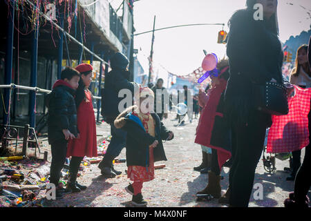 Brooklyn, USA. 18th Feb, 2018. Brooklyn residents and visitors converge on the neighborhood of Sunset Park in New York, Brooklyn's Chinatown, to celebrate the Year of the Dog at the annual Chinese Lunar New Year Parade on Sunday, February 18, 2018. Sunset Park is home to many Chinese immigrants and is known as Brooklyn's Chinatown. Credit: Richard Levine/Alamy Live News Stock Photo