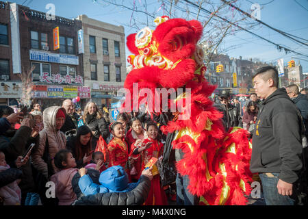 Brooklyn, USA. 18th Feb, 2018. Lion dancing in the neighborhood of Sunset Park in New York, Brooklyn's Chinatown, celebrating the Year of the Dog during the annual Chinese Lunar New Year Parade on Sunday, February 18, 2018. Sunset Park is home to many Chinese immigrants and is known as Brooklyn's Chinatown. Credit: Richard Levine/Alamy Live News Stock Photo