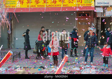 Brooklyn, USA. 18th Feb, 2018. Brooklyn residents and visitors converge on the neighborhood of Sunset Park in New York, Brooklyn's Chinatown, to celebrate the Year of the Dog at the annual Chinese Lunar New Year Parade on Sunday, February 18, 2018. Sunset Park is home to many Chinese immigrants and is known as Brooklyn's Chinatown. Credit: Richard Levine/Alamy Live News Stock Photo