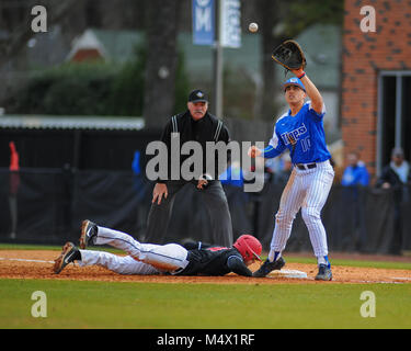 FedEx Park. 18th Feb, 2018. TN, USA; Memphis Tigers 1B, Kyle Ouellette (10), attempts to catch the ball as the Western Kentucky player slides into the base. Western Kentucky defeated the Memphis Tigers, 3-1, at FedEx Park. Kevin Lanlgey/CSM/Alamy Live News Stock Photo