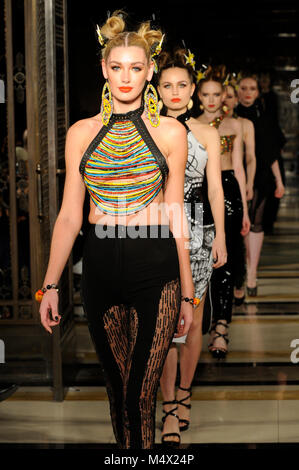 Model on the catwalk during the Limkokwing University fashion show at Fashion Scout AW18 at Freemasons Hall, Covent Garden, London, UK. Fashion Scout takes place during London Fashion Week. With a base in Chancery Lane, London, Limkokwing is a private Malaysian university which operates in 14 countries across the world and teaches students in creative technology. It is the first university to open its own fashion label, Limkokwing Fashion Club, with designs created by students on campus. 18th February 2018. Credit: Antony Nettle/Alamy Live News Stock Photo