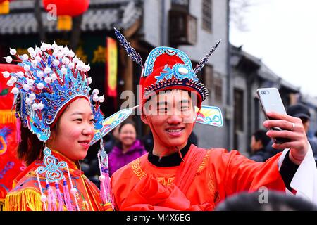 Weifang, China's Shandong Province. 19th Feb, 2018. Two performers take a selfie in Weifang, east China's Shandong Province, Feb. 19, 2018., the fifth day of the Spring Festival holiday. Credit: Wang Jilin/Xinhua/Alamy Live News Stock Photo