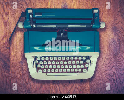 A Retro Vintage Typewriter On A Rustic Wooden Table Stock Photo