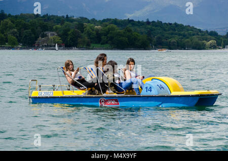 Group of four girls pedal boating in Lake Geneva, Switzerland Stock Photo
