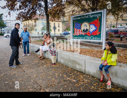 Visitors with welcome sign for Hot Springs, Arkansas--hometown of American president, Bill Clinton. Stock Photo