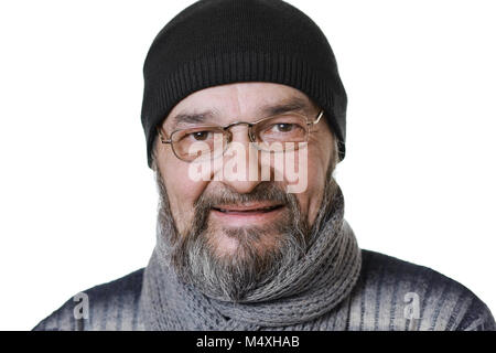 Man with a beard in a hat and scarf, smiling looks at the camera on a white background Stock Photo